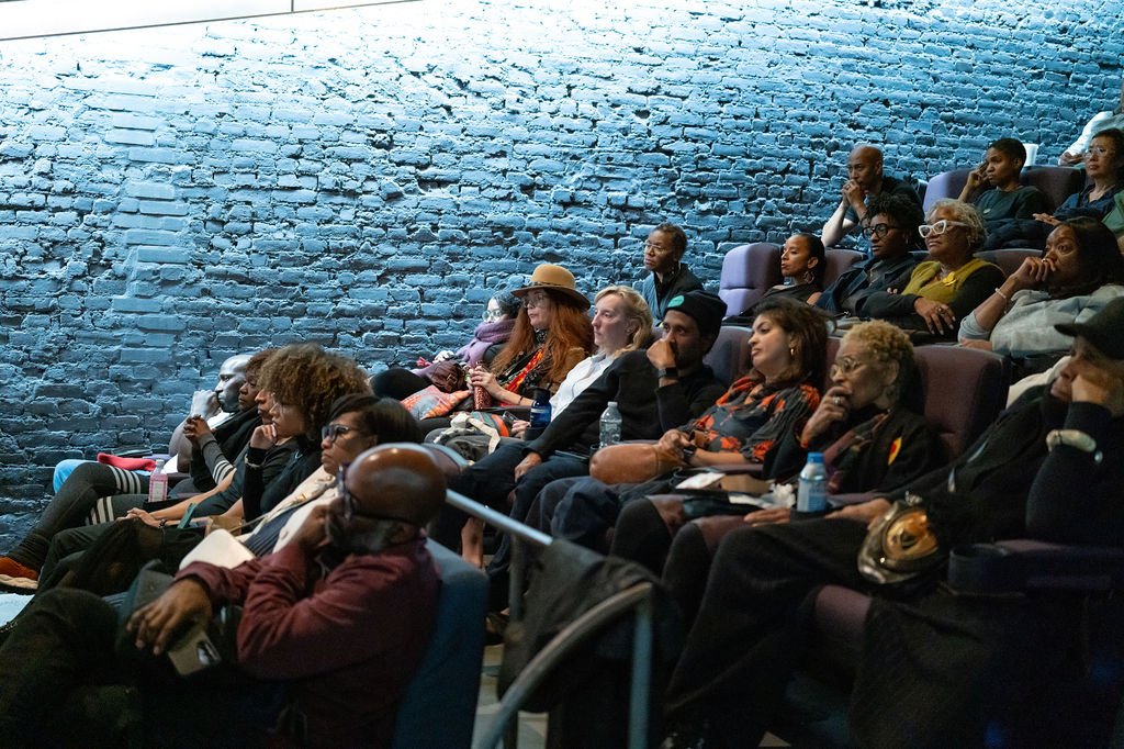 Community members gathered at a Standing in the Gap Fund event